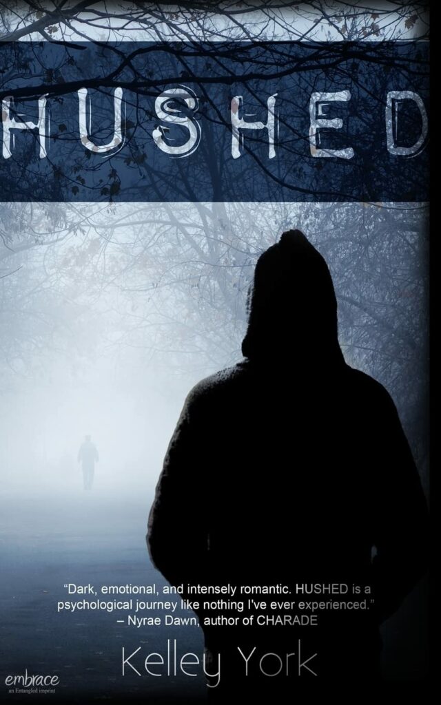 Image of a book cover for Hushed with a dark, foggy street and a mysterious young man dressed in a black hoodie